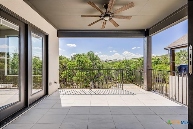 exterior space featuring ceiling fan