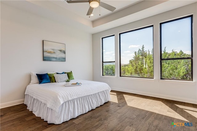 bedroom featuring ceiling fan and dark wood-type flooring