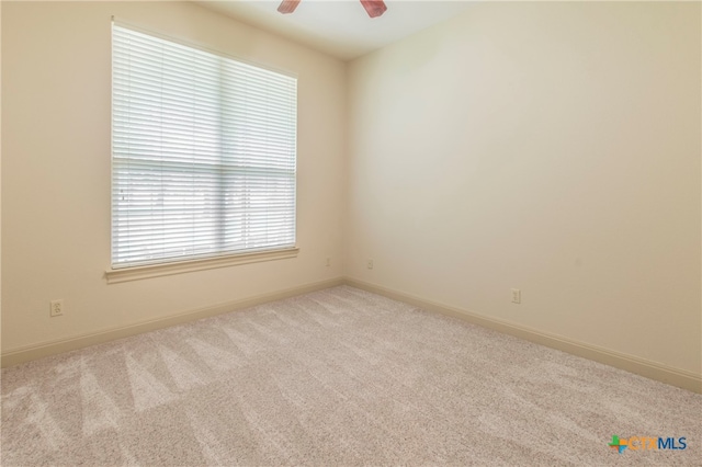 carpeted empty room with ceiling fan