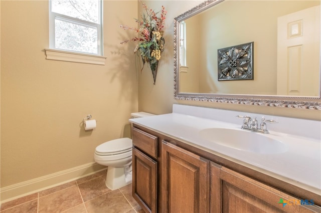 bathroom with tile patterned floors, vanity, and toilet