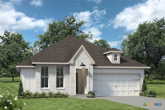 view of front of house with a garage and a front lawn