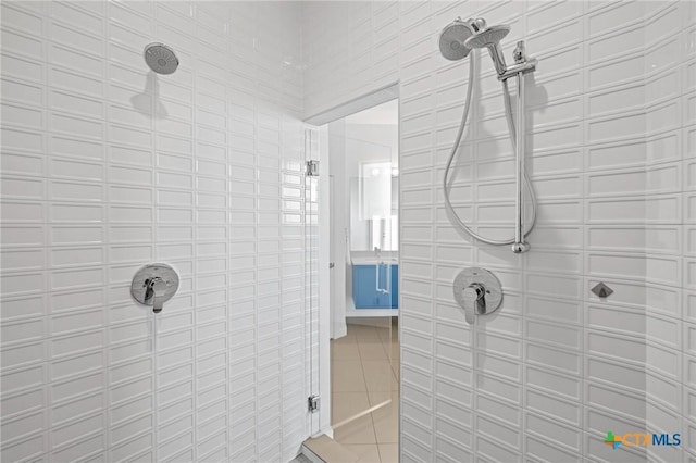 215 Mesa Vista Dr, Leander, TX 78641 - full bathroom with tiled shower, tile patterned floors, and tile walls