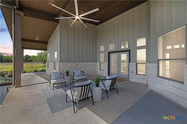 215 Mesa Vista Dr, Leander, TX 78641 - patio terrace at dusk with french doors, ceiling fan, a patio area, and an outdoor living space