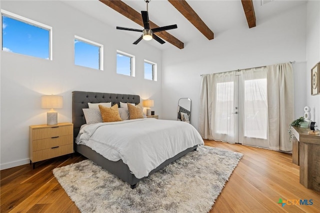 215 Mesa Vista Dr, Leander, TX 78641 - bedroom with beam ceiling, wood finished floors, ceiling fan, and access to outside