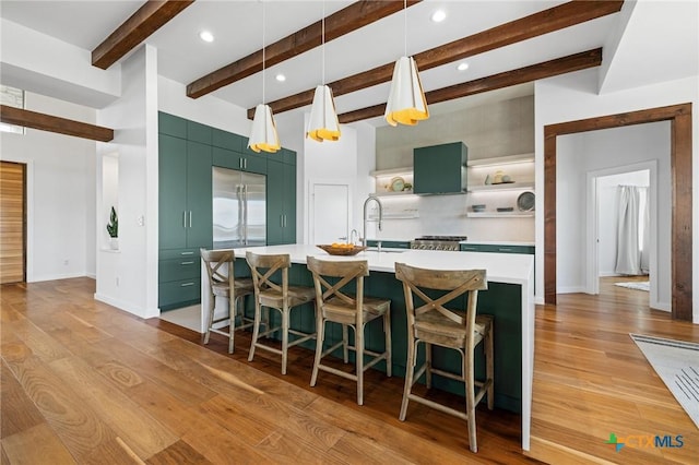215 Mesa Vista Dr, Leander, TX 78641 - kitchen featuring open shelves, green cabinetry, light countertops, light wood-type flooring, and beam ceiling