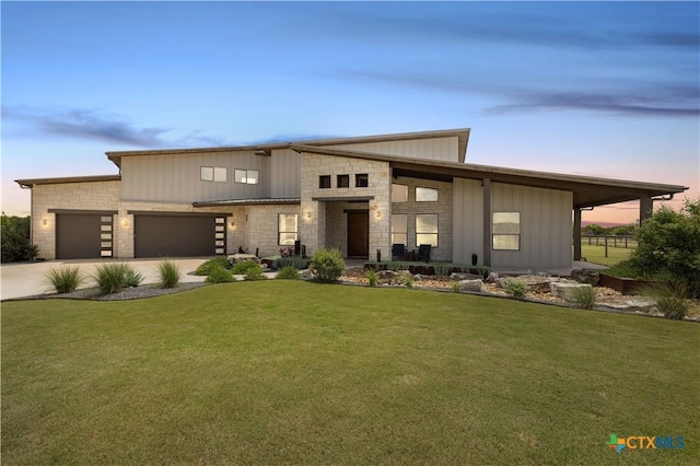 215 Mesa Vista Dr, Leander, TX 78641 - contemporary home with driveway, an attached garage, board and batten siding, and stone siding