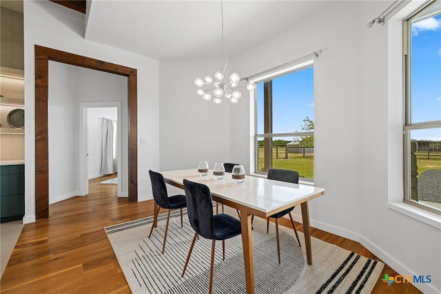 215 Mesa Vista Dr, Leander, TX 78641 - dining room with a chandelier and wood finished floors