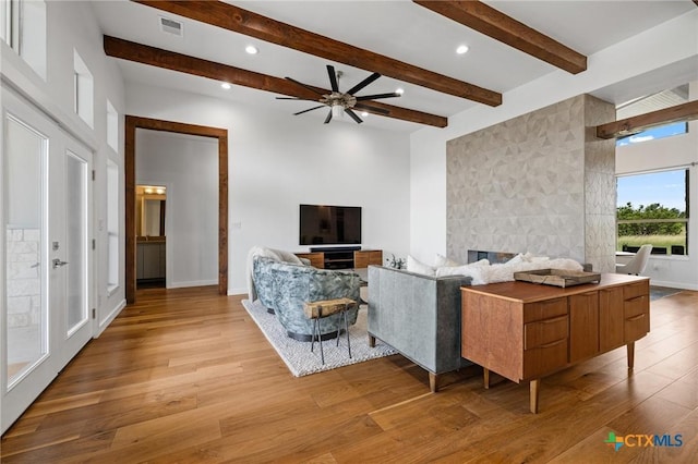 215 Mesa Vista Dr, Leander, TX 78641 - living area with light wood finished floors, ceiling fan, recessed lighting, and beamed ceiling