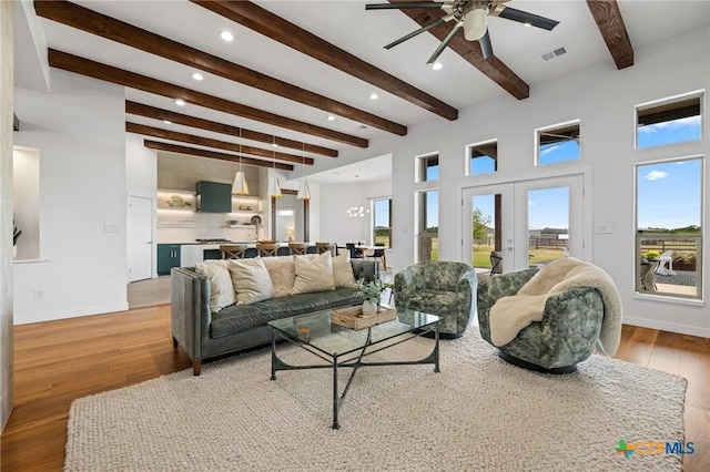 215 Mesa Vista Dr, Leander, TX 78641 - living room featuring beamed ceiling, light wood finished floors, plenty of natural light, ceiling fan, and recessed lighting