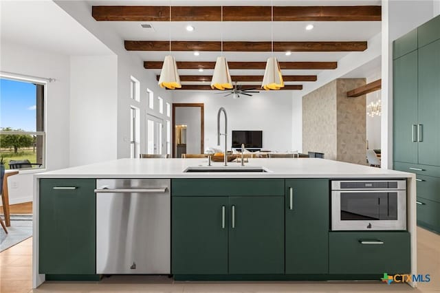 215 Mesa Vista Dr, Leander, TX 78641 - kitchen featuring green cabinets, stainless steel appliances, light countertops, beamed ceiling, and recessed lighting
