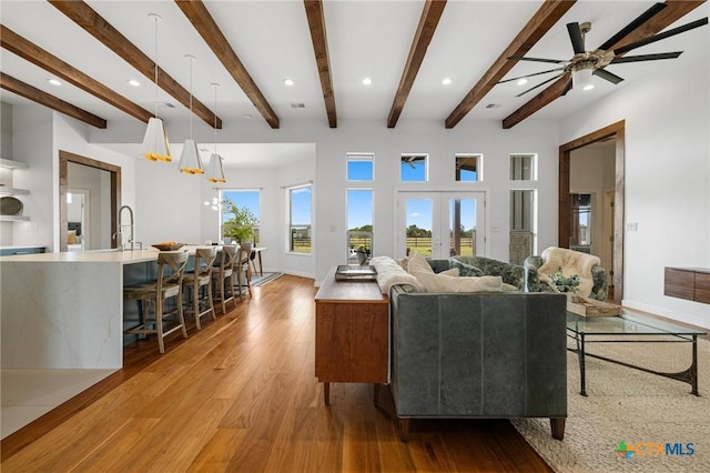 215 Mesa Vista Dr, Leander, TX 78641 - living area featuring light wood-type flooring, recessed lighting, beam ceiling, and a ceiling fan
