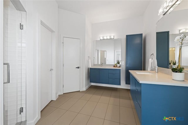 215 Mesa Vista Dr, Leander, TX 78641 - bathroom with two vanities, a shower stall, and tile patterned flooring