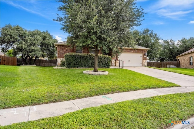5507 Sulfur Spring Dr, Killeen, TX 76542 - view of property hidden behind natural elements featuring concrete driveway, a garage, and brick siding