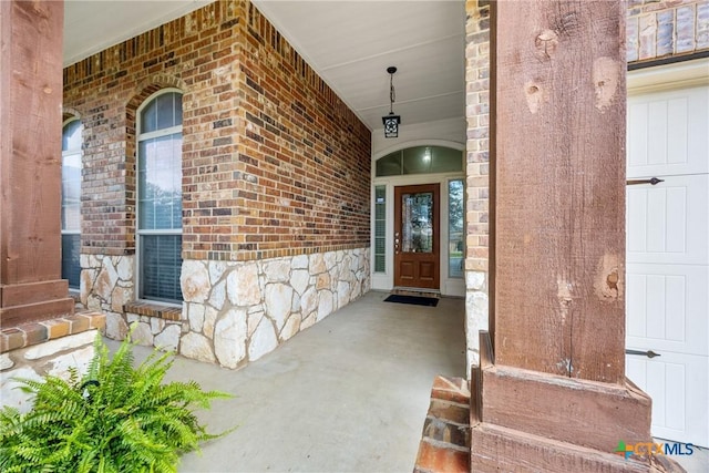 5507 Sulfur Spring Dr, Killeen, TX 76542 - doorway to property with stone siding, covered porch, and brick siding