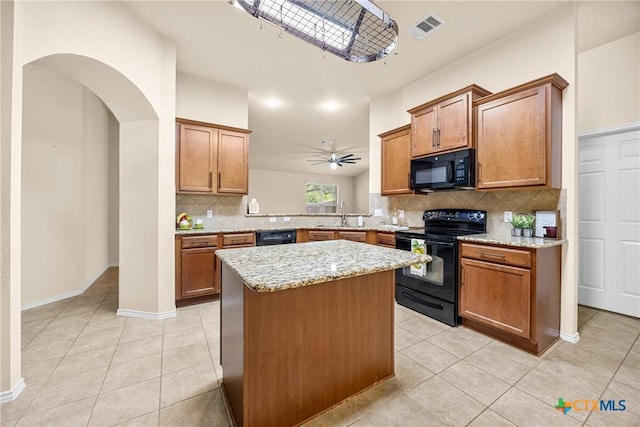 5507 Sulfur Spring Dr, Killeen, TX 76542 - kitchen featuring black appliances, light tile patterned floors, backsplash, and brown cabinetry