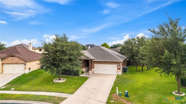 5507 Sulfur Spring Dr, Killeen, TX 76542 - view of front of home with concrete driveway, a front lawn, an attached garage, and brick siding