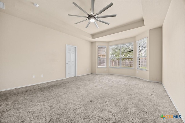 5507 Sulfur Spring Dr, Killeen, TX 76542 - spare room featuring carpet floors, a raised ceiling, a ceiling fan, and a smoke detector