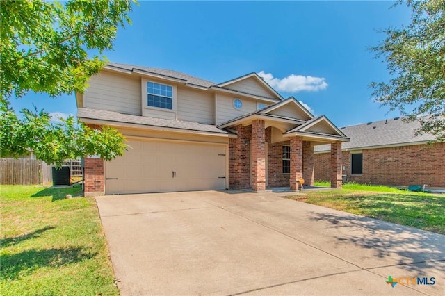 view of front of property with a garage and a front yard