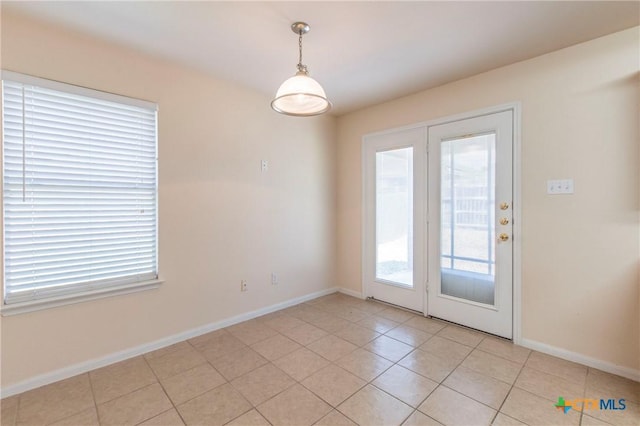 entryway featuring light tile patterned flooring