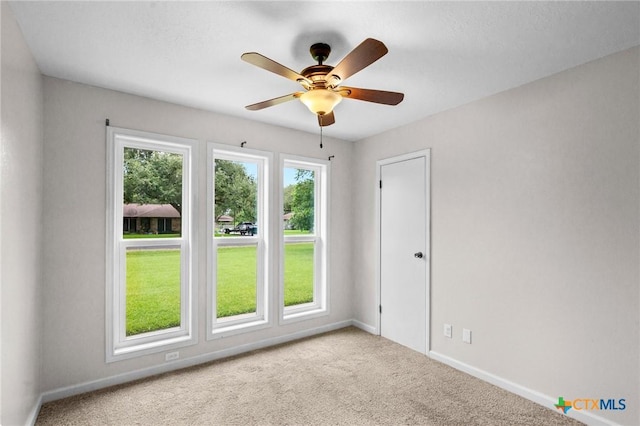 305 Berwick St, Victoria, TX 77904 - carpeted spare room with baseboards and ceiling fan