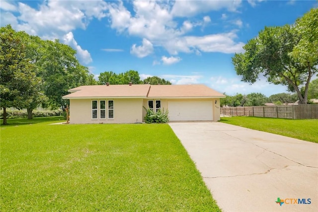 305 Berwick St, Victoria, TX 77904 - single story home featuring a garage, concrete driveway, and stucco siding
