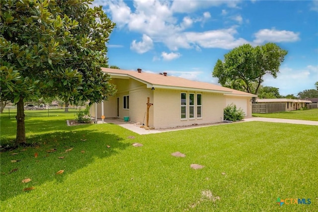 305 Berwick St, Victoria, TX 77904 - view of front of house featuring concrete driveway, an attached garage, and brick siding