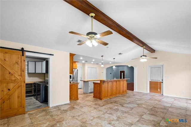 305 Berwick St, Victoria, TX 77904 - kitchen featuring ceiling fan, arched walkways, a kitchen breakfast bar, a center island, and light countertops