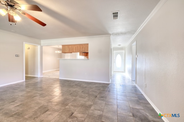 spare room featuring ornamental molding, a textured ceiling, and ceiling fan