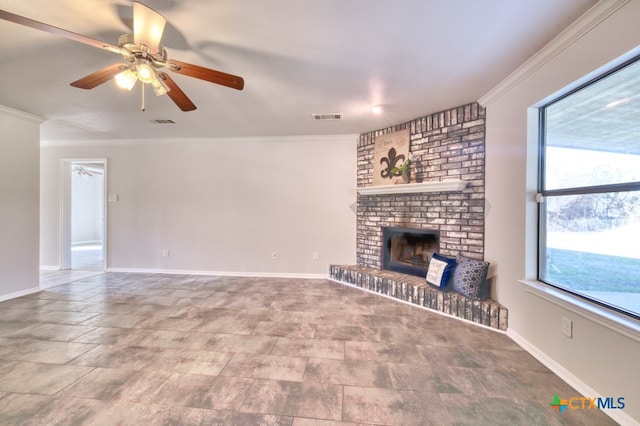 unfurnished living room with crown molding, ceiling fan, and a fireplace