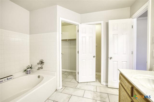 bathroom with vanity and a bathtub