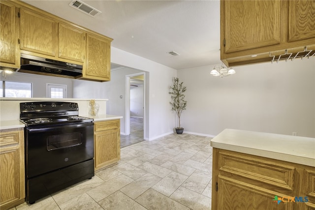 kitchen featuring pendant lighting, black range with electric stovetop, and exhaust hood