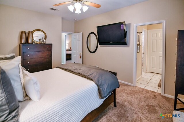 207 C L Duckett Dr, Cuero, TX 77954 - tiled bedroom featuring carpet flooring, baseboards, and a ceiling fan