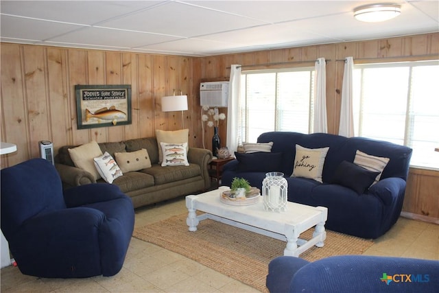 living room with wood walls and a wall mounted AC