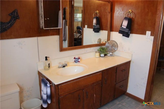 bathroom featuring vanity and toilet