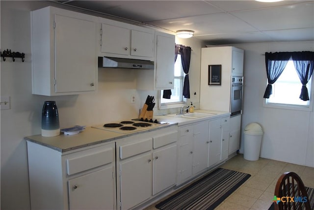 kitchen with white cabinets and plenty of natural light