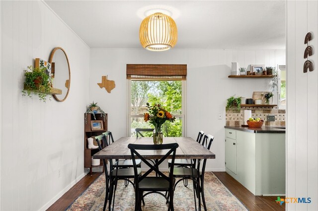 812 Merritt Dr, Lockhart, TX 78644 - dining space with dark wood-style floors and baseboards