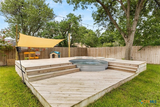 812 Merritt Dr, Lockhart, TX 78644 - deck with a fenced backyard and an outdoor hot tub