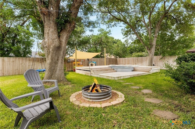 812 Merritt Dr, Lockhart, TX 78644 - fenced backyard featuring a fire pit