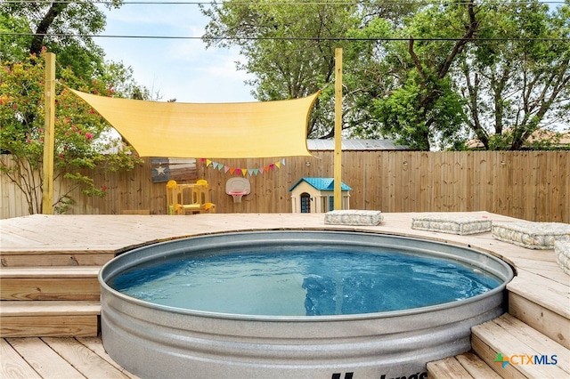 812 Merritt Dr, Lockhart, TX 78644 - view of swimming pool featuring a deck and a fenced backyard