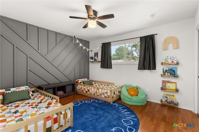 812 Merritt Dr, Lockhart, TX 78644 - bedroom with wood finished floors and a ceiling fan