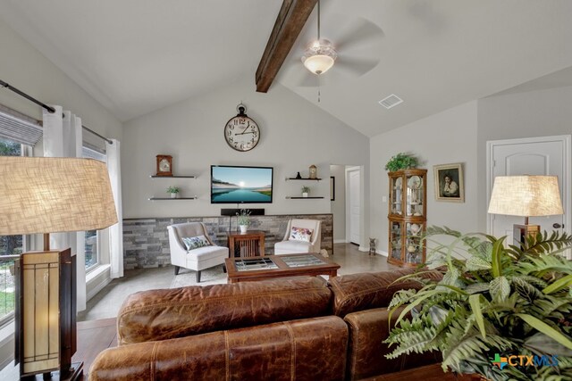 living room featuring beam ceiling, high vaulted ceiling, and ceiling fan