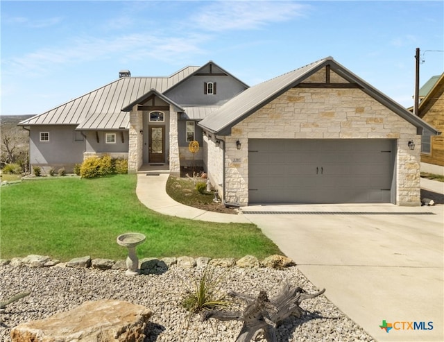 view of front of house featuring a standing seam roof, stone siding, concrete driveway, an attached garage, and metal roof