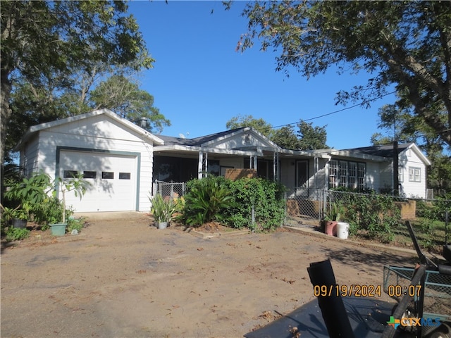 ranch-style house featuring a garage