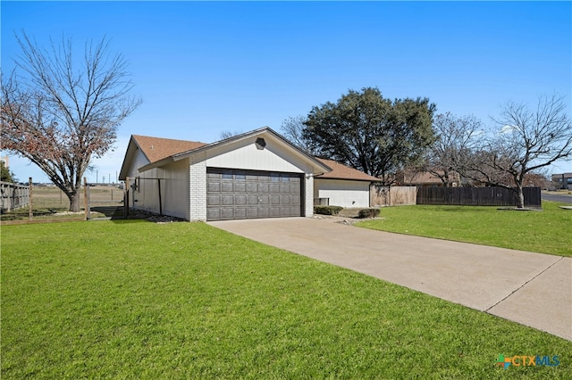 single story home featuring a garage and a front yard