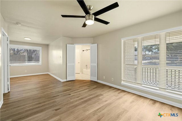 unfurnished bedroom featuring ceiling fan and hardwood / wood-style floors