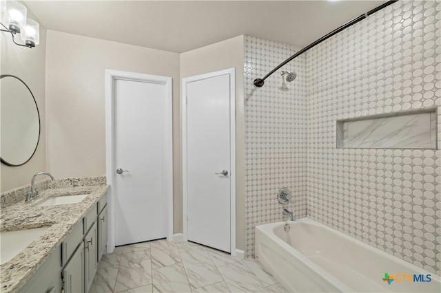 bathroom with vanity and  shower combination