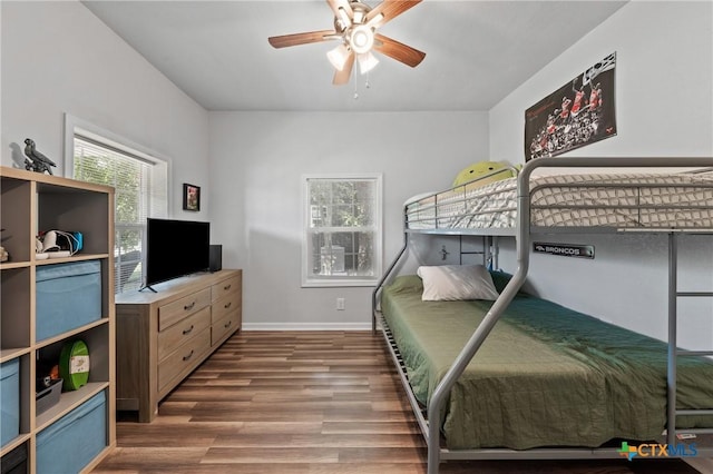 1107 Waco St, Gatesville, TX 76528 - bedroom featuring wood finished floors, baseboards, and a ceiling fan