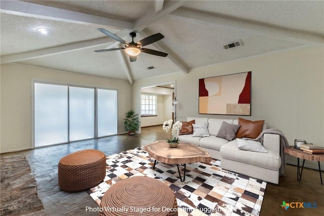 living room featuring a textured ceiling, lofted ceiling with beams, and ceiling fan