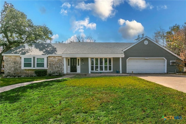 ranch-style house with a front yard and a garage