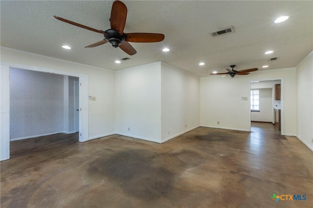 spare room with ceiling fan and a textured ceiling